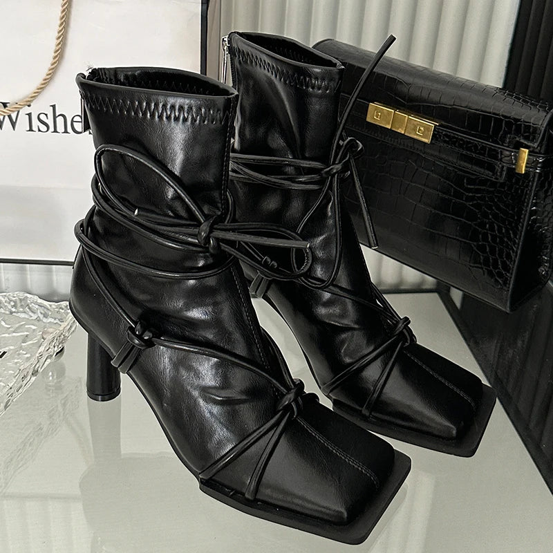 Cross-tied stretch ankle boots